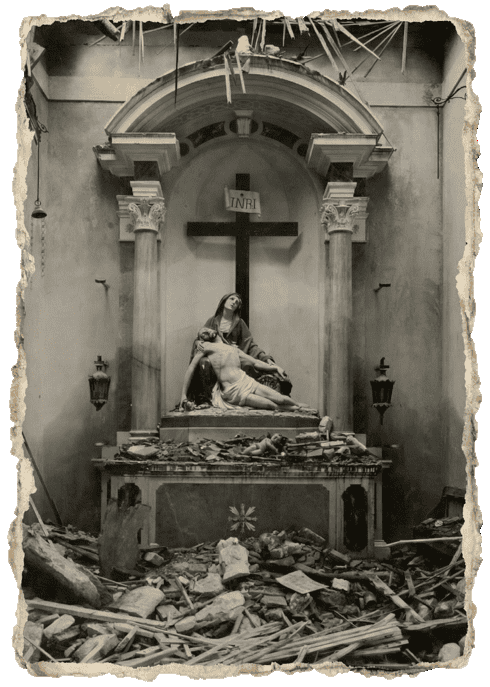 Pietà sculpture surrounded by debris